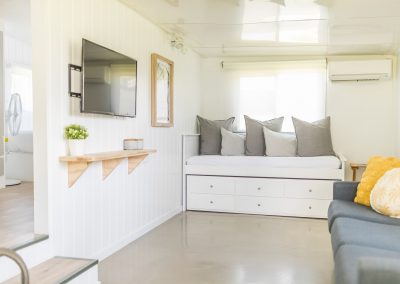 Surfside Caravan 1 Living with single trundle day bed and 3 seater sofa